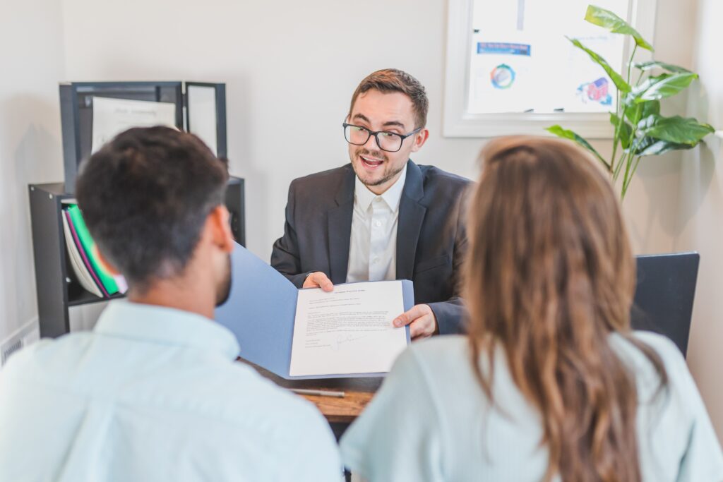 Financial advisor discussing a lease purchase with homebuyers