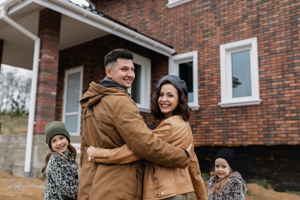 Family entering their new home